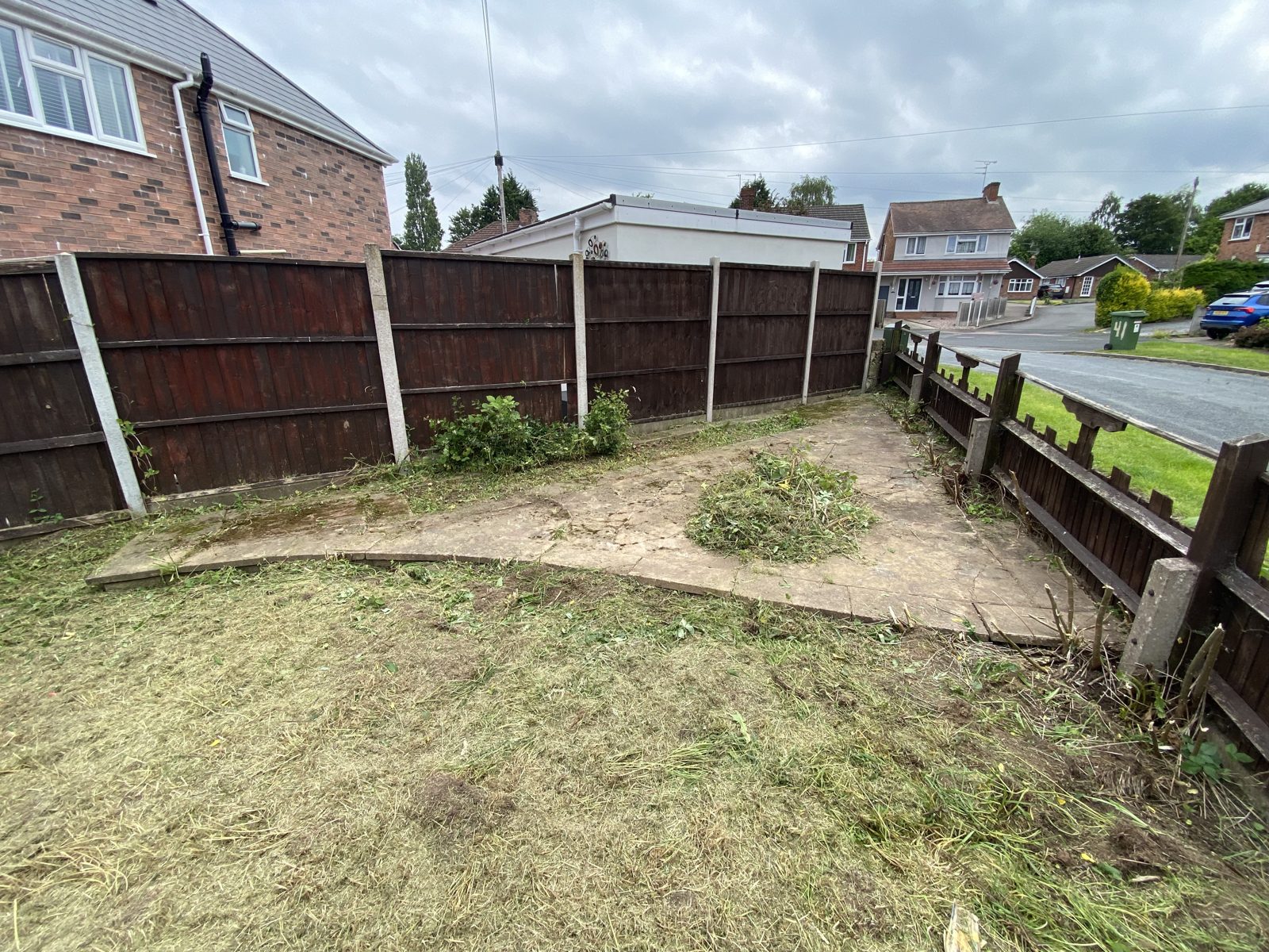 Cleared paving and neatly cut lawn after the job