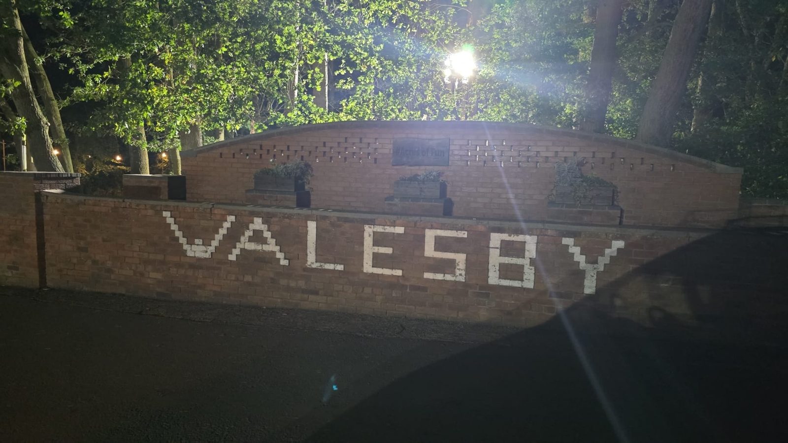 Walesby Forest entrance sign at night