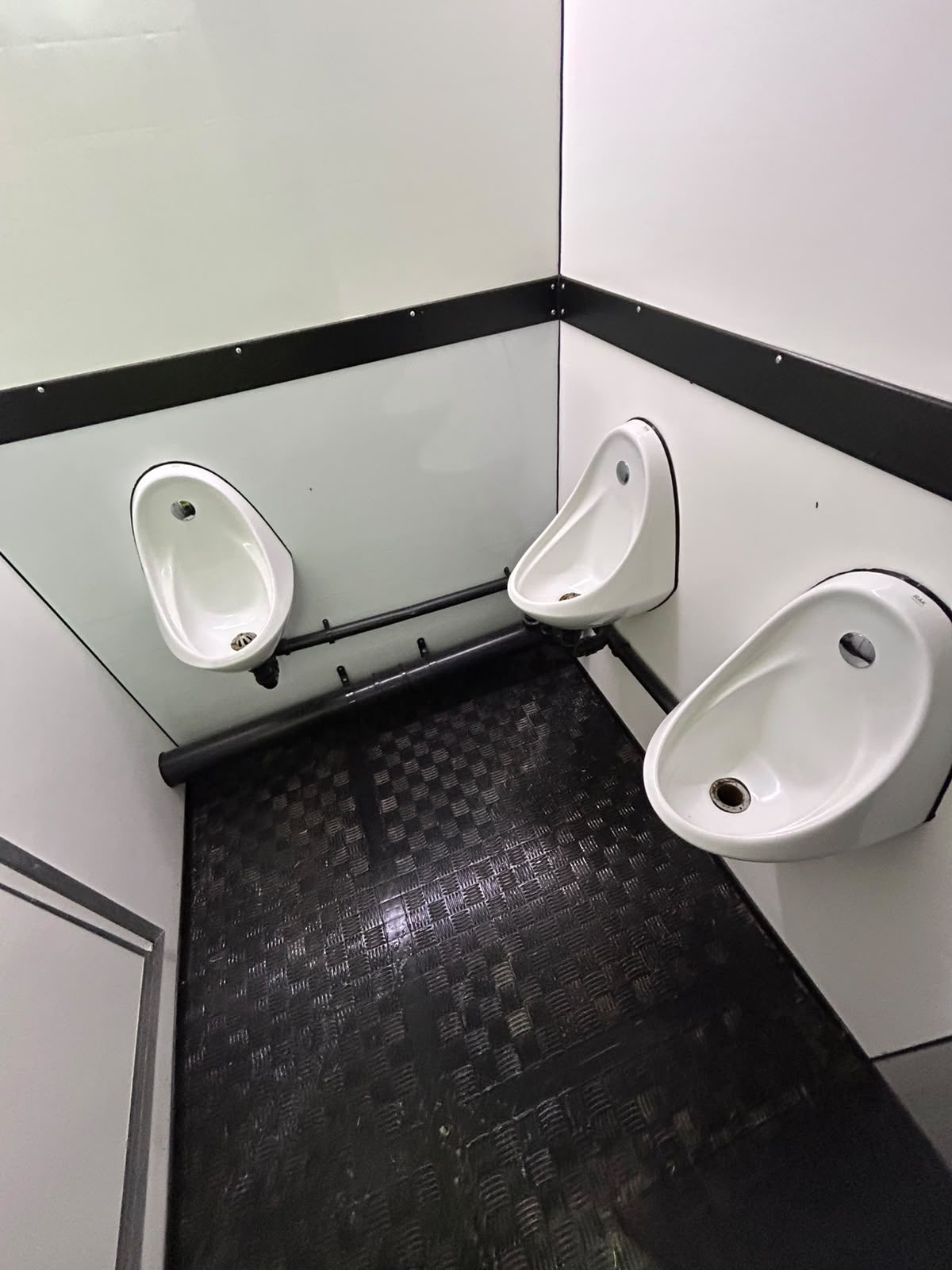 Urinals and floor cleaned in a festival toilet unit